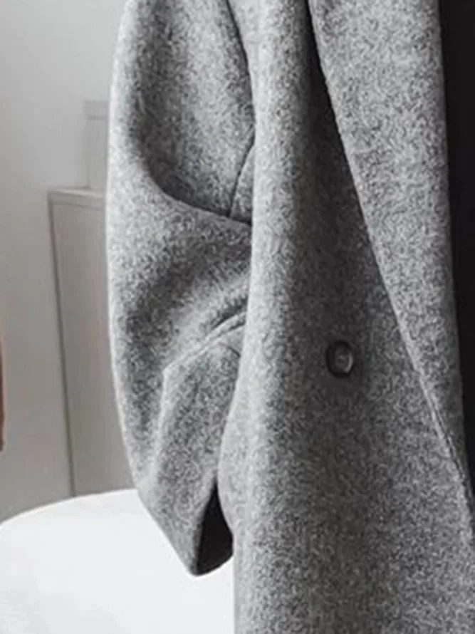 Manteau long élégant à double bouton et coupe ample
