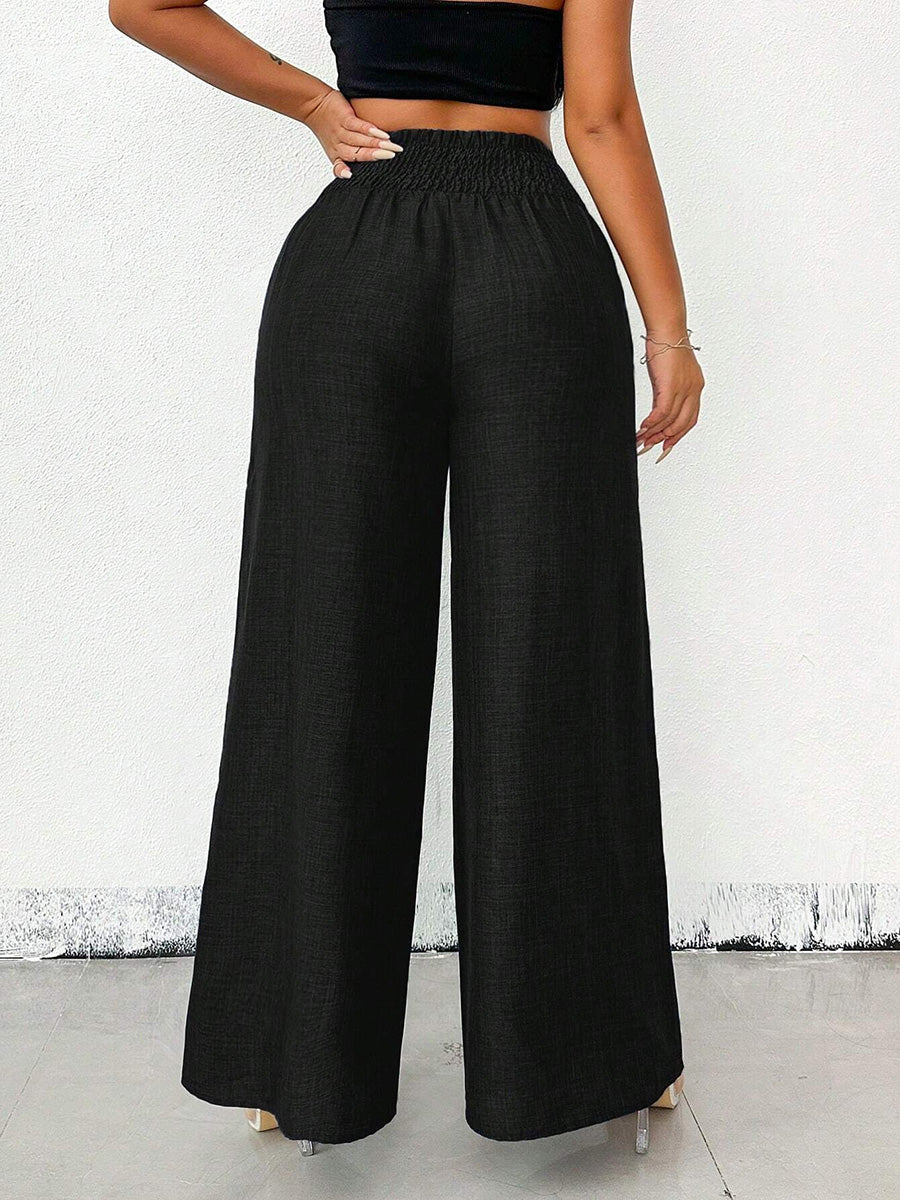 Détail de la taille haute du pantalon femme uni