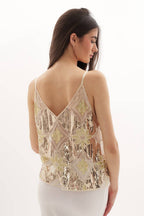 Blouse en tulle transparent brodée noir et or