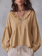 Vue arrière de la blouse femme unie à volants