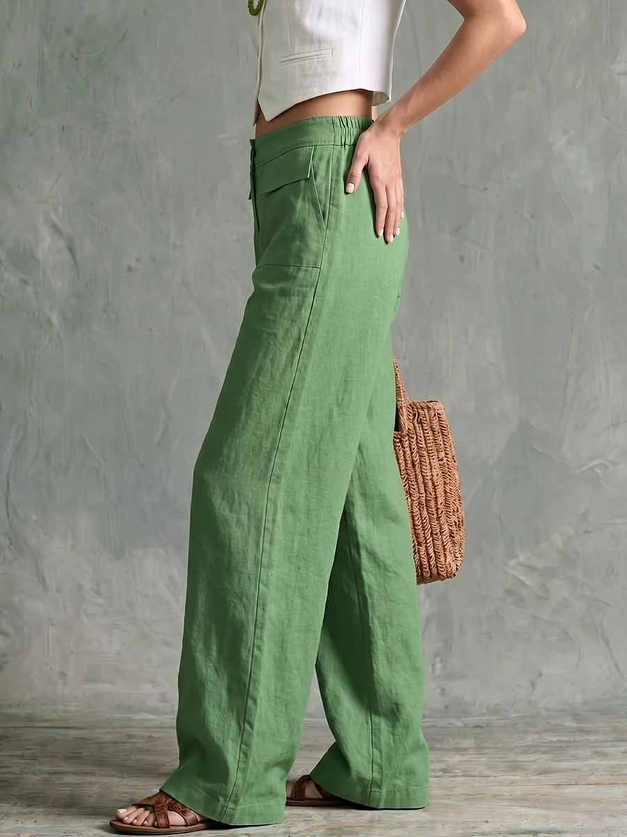 Vue de face du pantalon large vert pour femme avec fermeture boutonnée