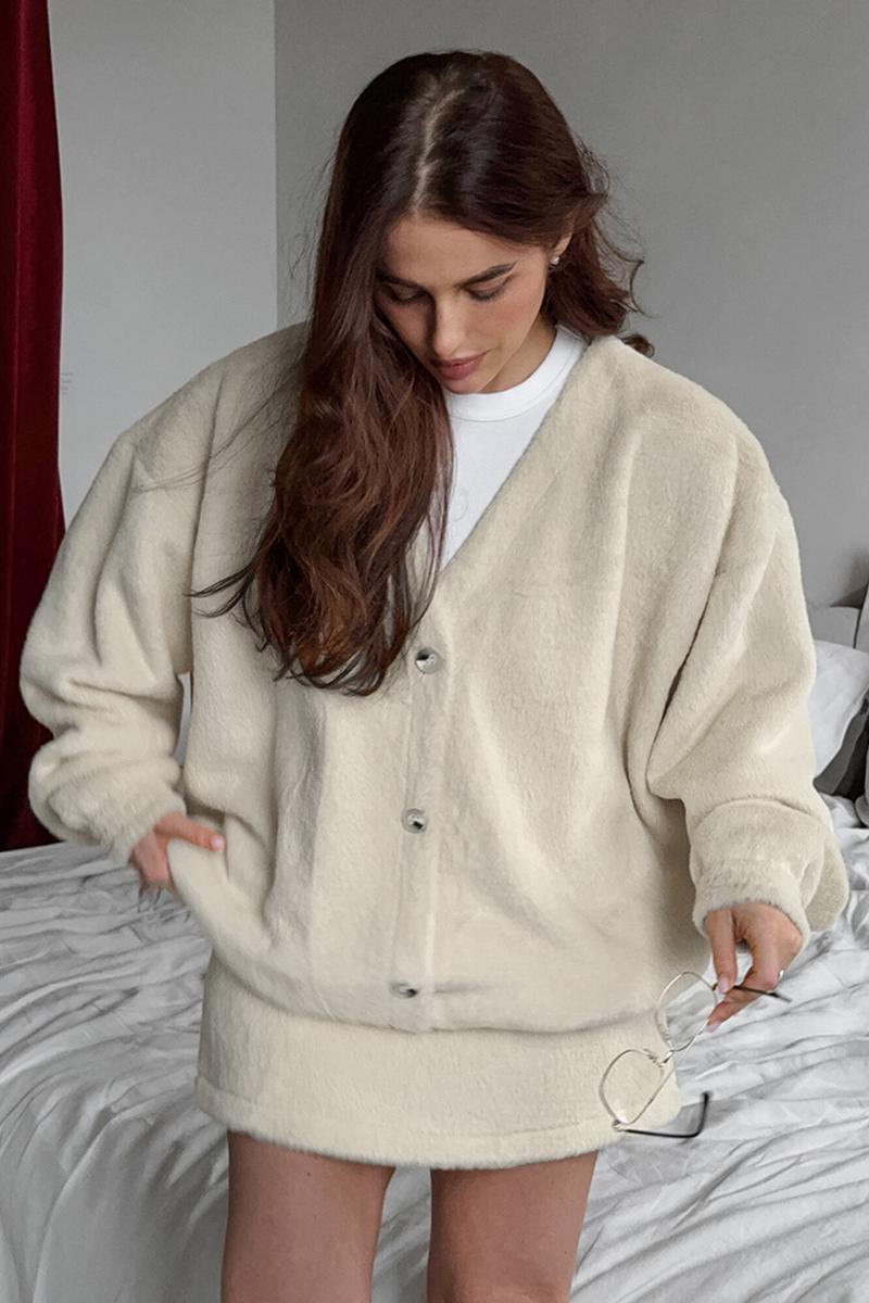 Ensemble chic manteau à manches longues et mini jupe taille haute