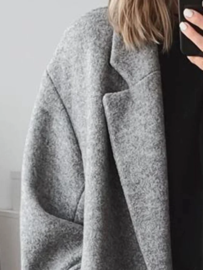 Manteau long élégant à double bouton et coupe ample