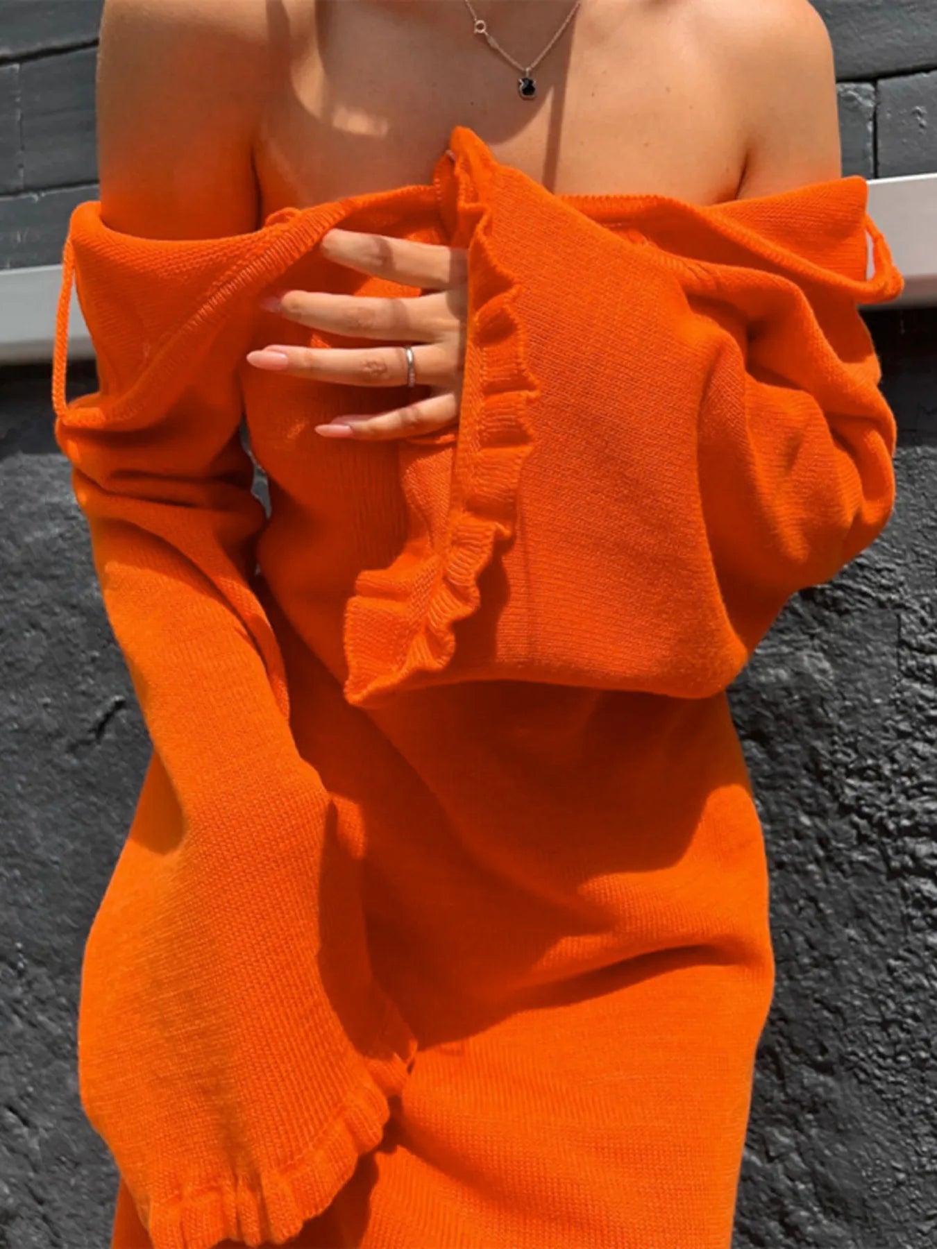Robe pull en maille à manches longues et dos nu