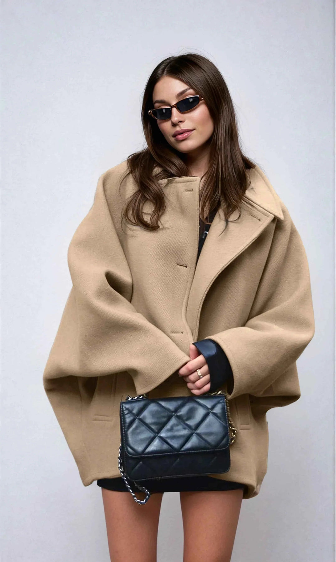 Manteau d'hiver oversize pour femme avec col à revers et boutons asymétriques