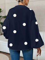 Blouse à pois élégante pour femme vue de dos