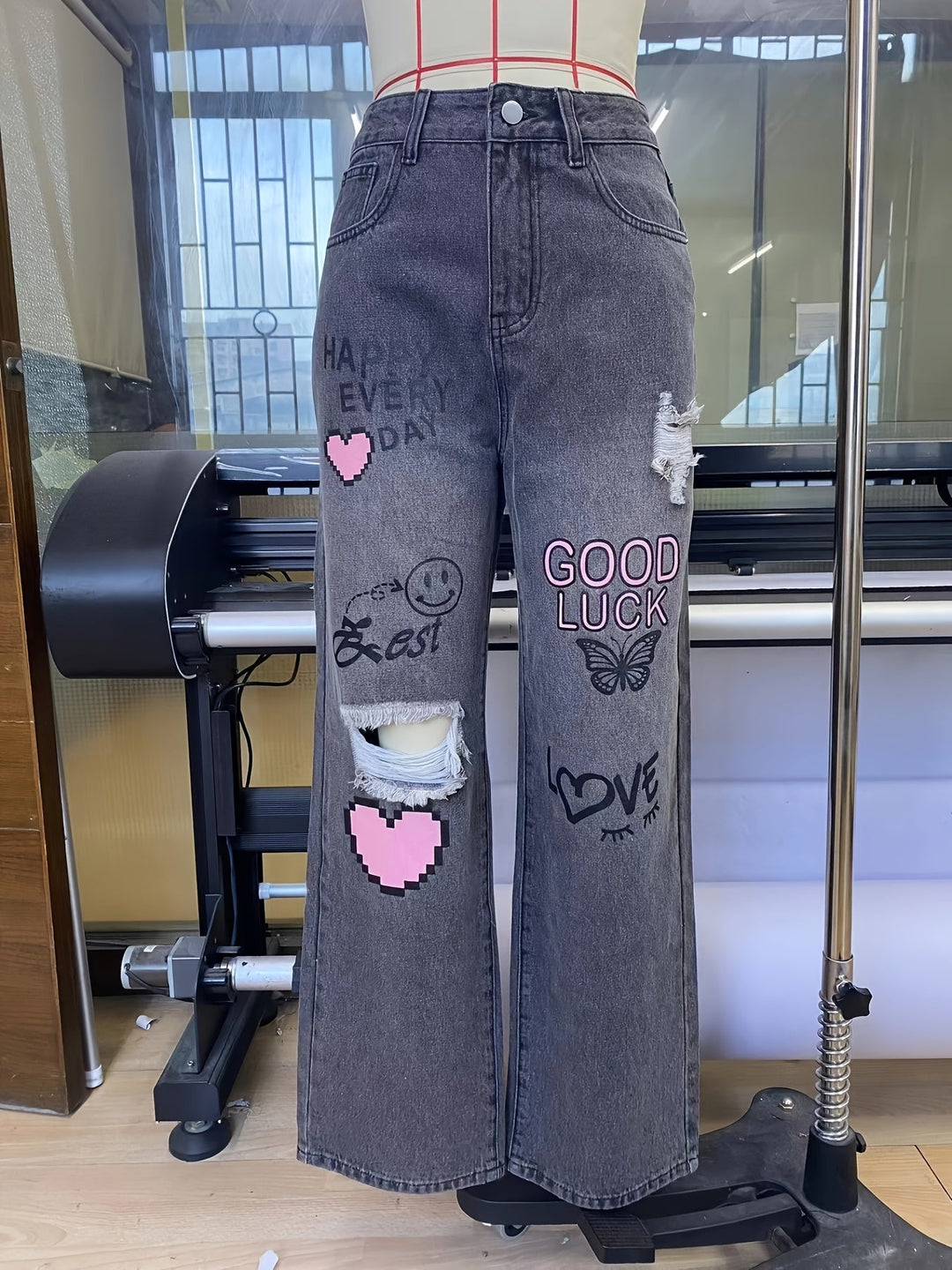 Jean en denim à taille haute et jambes larges avec imprimé graphique