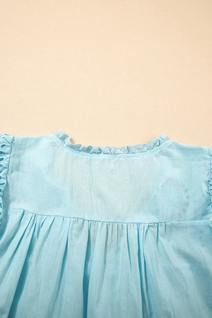 Blouse à manches bouffantes avec bordure en dentelle à œillets pour femmes