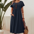 Robe mi-longue plissée à manches courtes avec poches